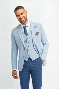 Abito da sposo estivo da uomo in lino azzurro cielo con pantaloni blu navy.
