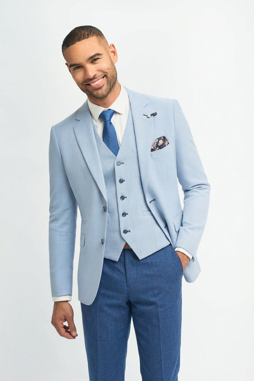 Abito da sposo estivo da uomo in lino azzurro cielo con pantaloni blu navy.