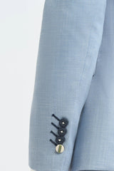 Abito da sposo estivo da uomo in lino azzurro cielo con pantaloni blu navy.