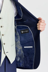 Abito blu navy Belmont con gilet a contrasto color salvia Belmont.