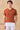 Polo da uomo a coste color arancio ruggine