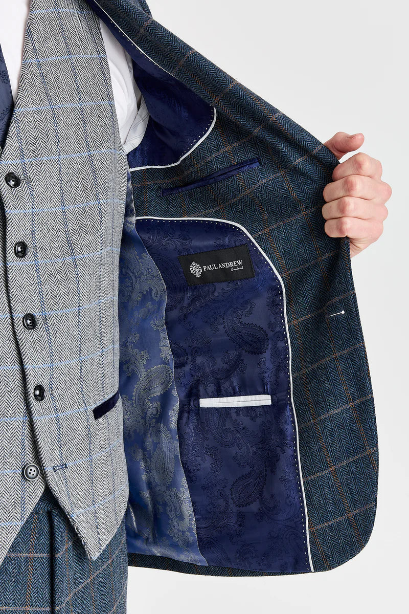 Abito Harris in tweed blu navy con gilet Harris in tweed grigio a contrasto.