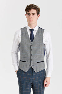 Abito Harris in tweed blu navy con gilet Harris in tweed grigio a contrasto.